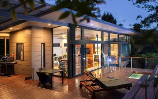 The private decks of the Luxury Mountain View Lodges are a great place to spend the evening in the rainforest near Byron Bay