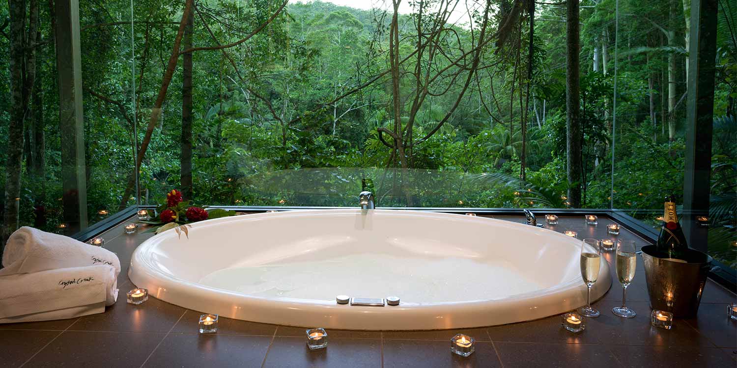 Rainforest Canopy Bungalow bathrooms have double spa baths with floor to ceiling rainforest views on three sides