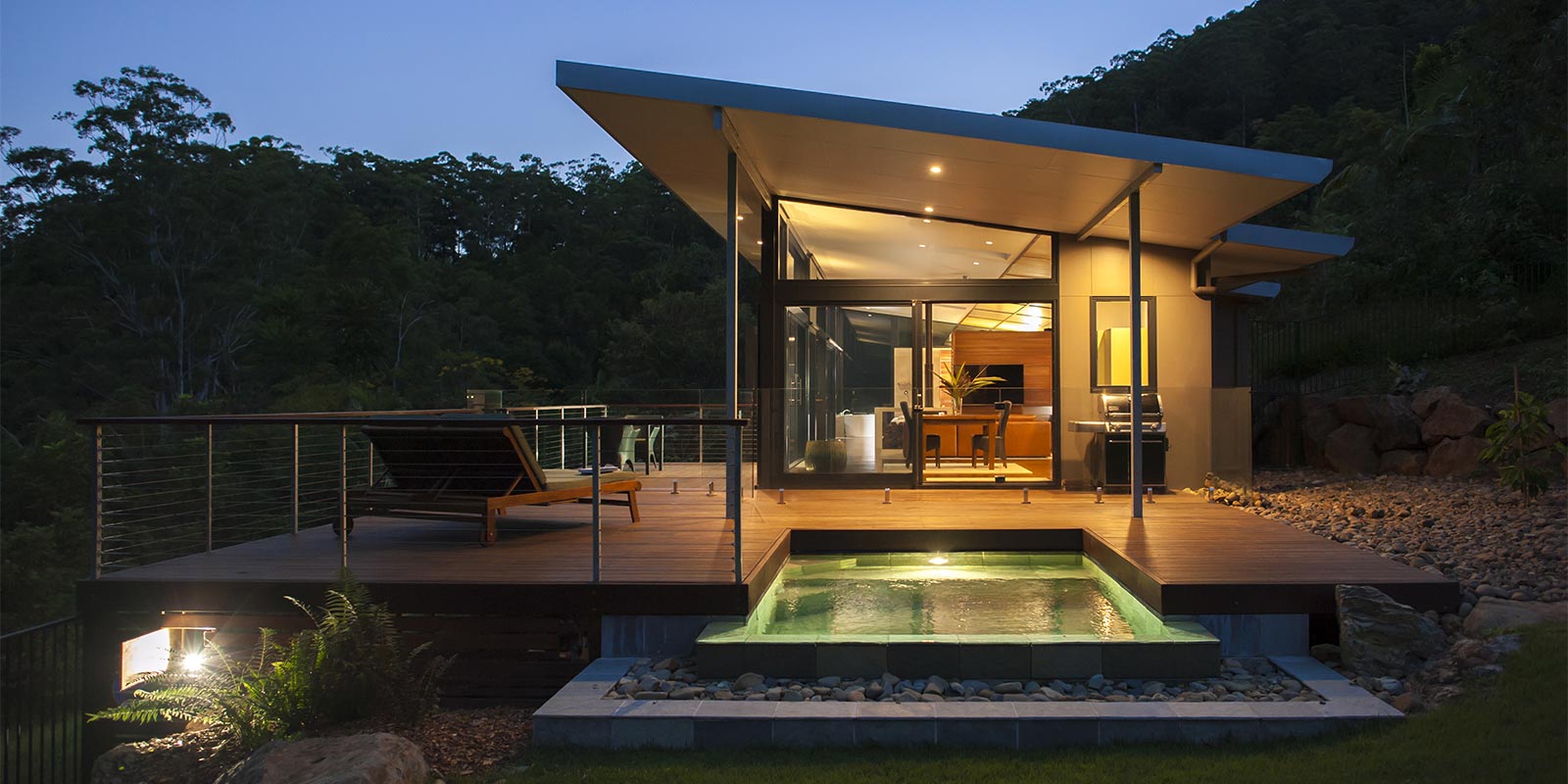 The private decks of the Luxury Mountain View Lodges are a great place to spend the evening in the rainforest near Byron Bay