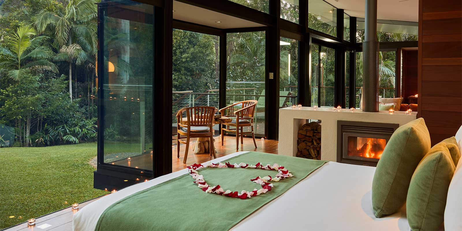 Luxury Mountain Lodge rainforest view from bed with fireplace